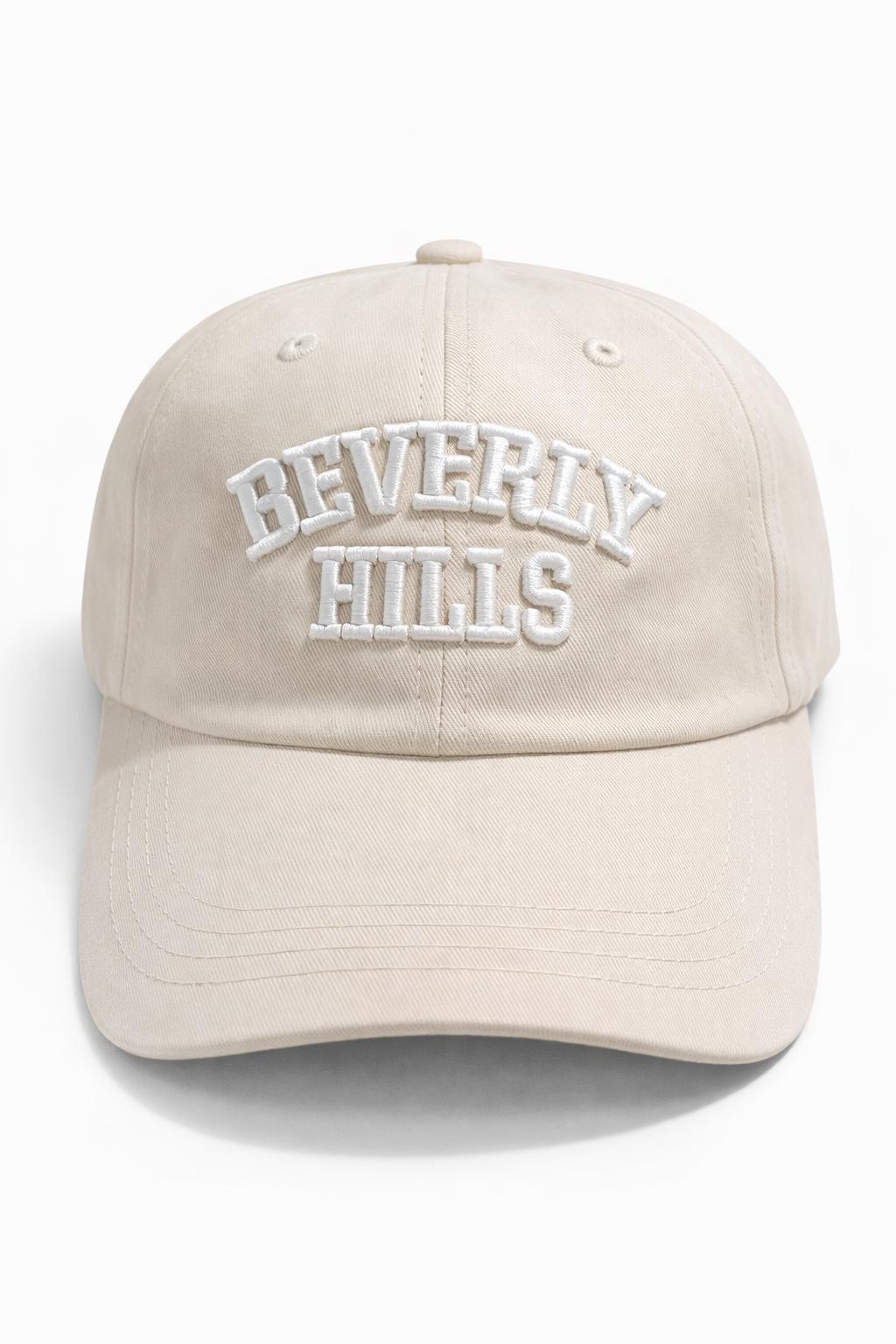 Beige cap with 'Beverly Hills' embroidery on a white background