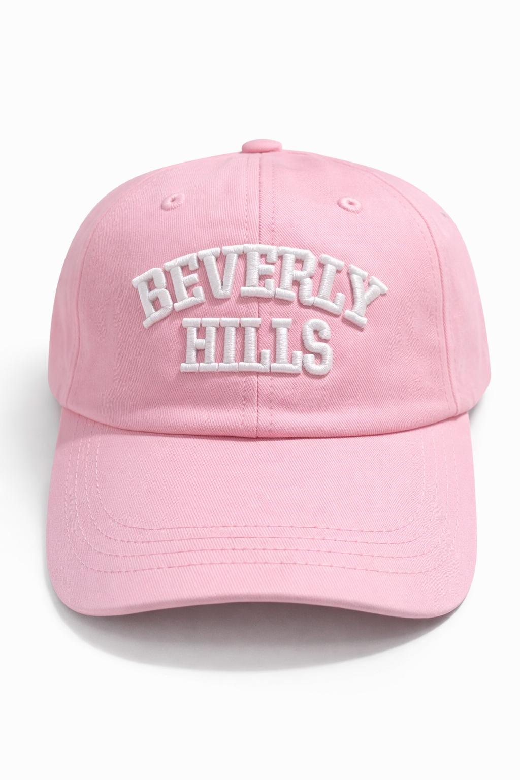 Pink cap with 'Beverly Hills' text on a white background